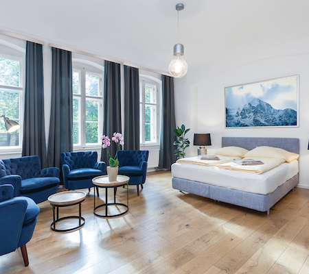 Luxurious Modern Bedroom with Sitting Area and King Bed